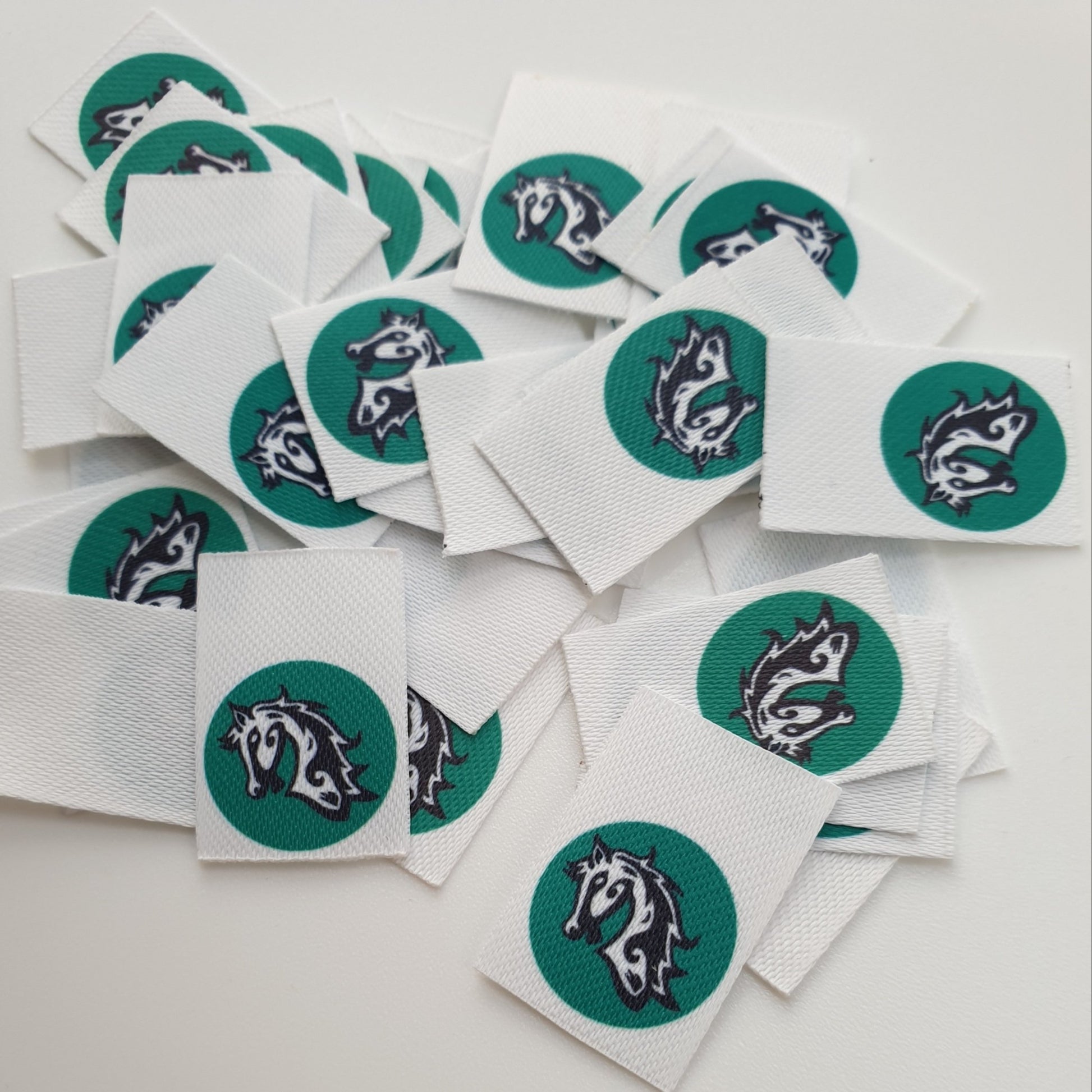 Textile labels with logo printed on them