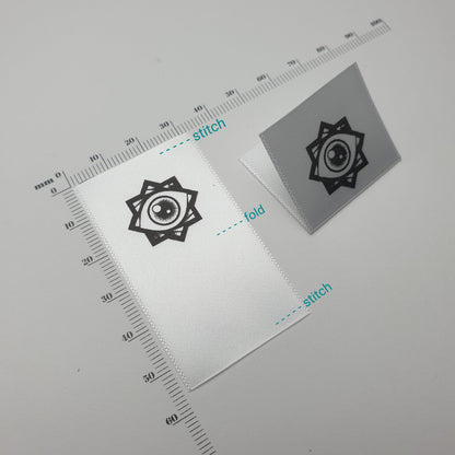 #08WS - HOT CUT WHITE SATIN HEM LABELS