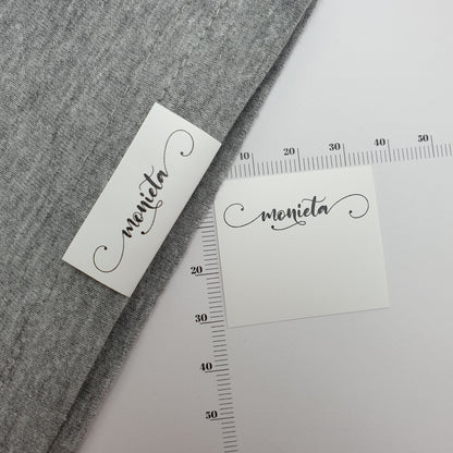 #07WPT - SEMI-PERMANENT SINGLE COLOUR PRINTED WHITE POLYESTER TAPE HEM LABELS